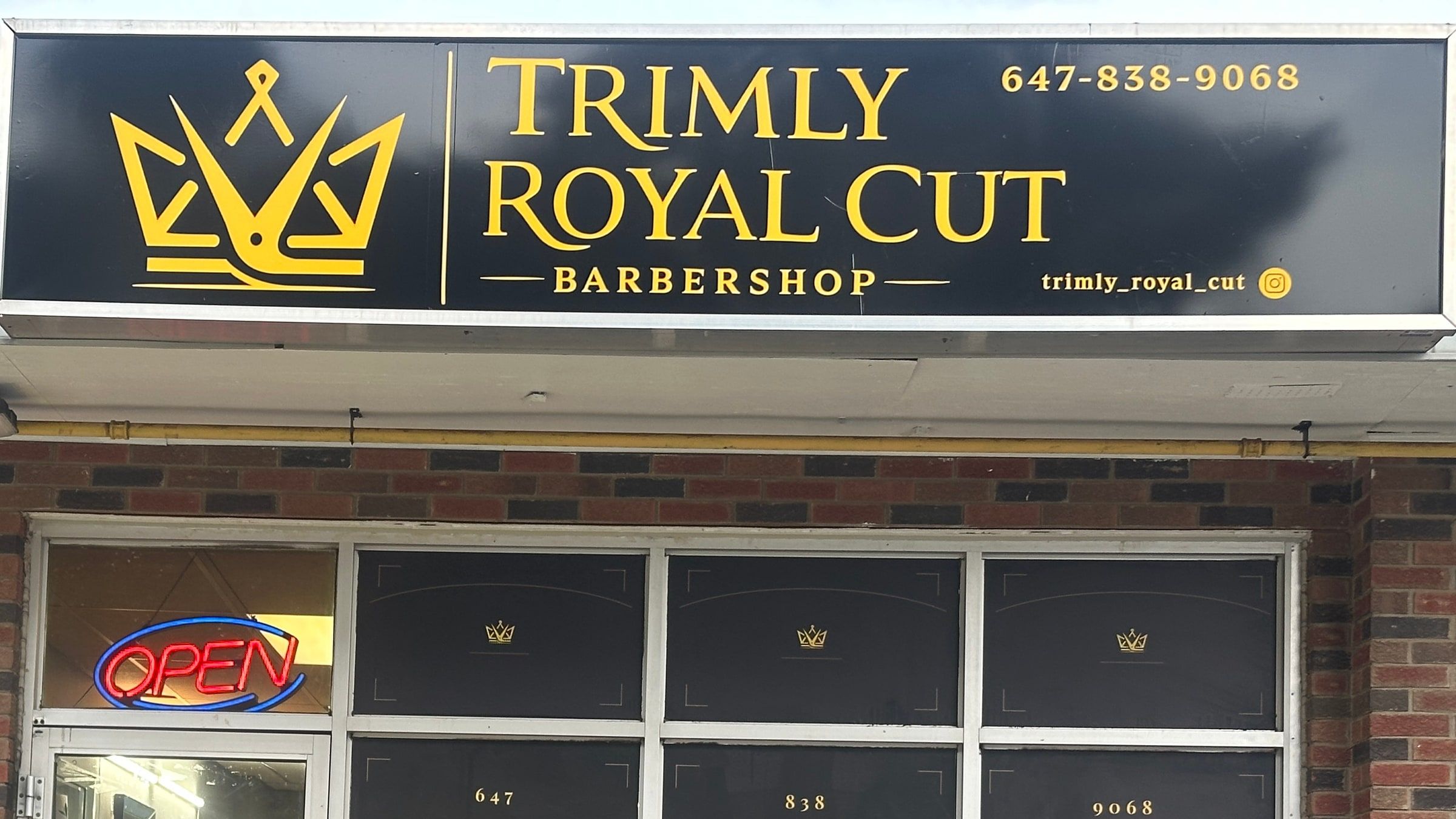 Trimly Royal Cut storefront with the gold crown sign
